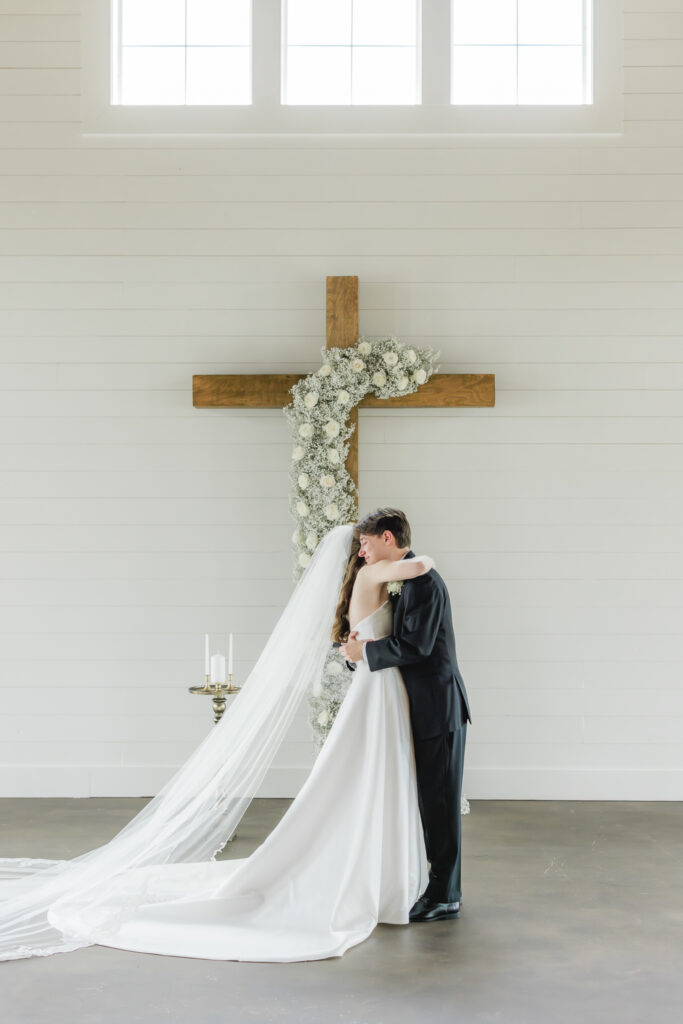 Bride and groom sharing their emotional first look at Ridge Pointe wedding venue.
