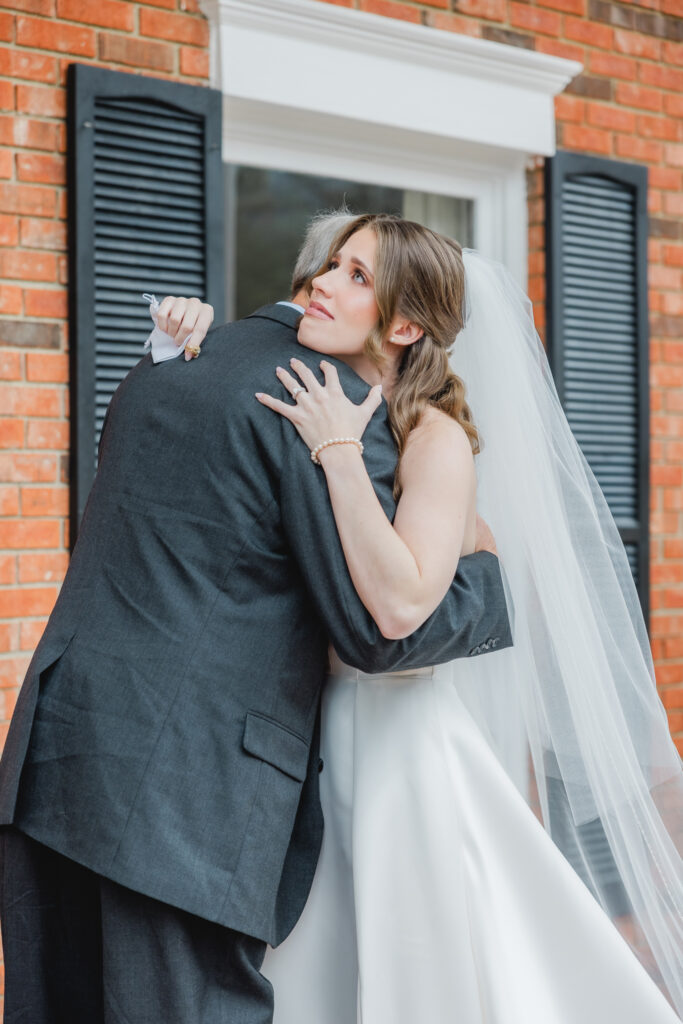 Emotional reactions during a first look with grandfather photographed by Birmingham wedding photographers.