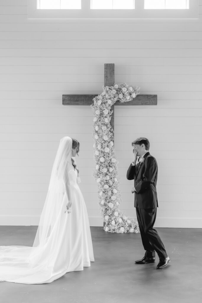 Emotional reactions during a first look photographed by Birmingham wedding photographers.