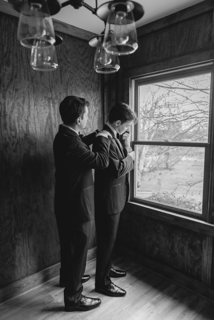 Groom getting ready with his brother before a Ridge Pointe wedding near Birmingham.