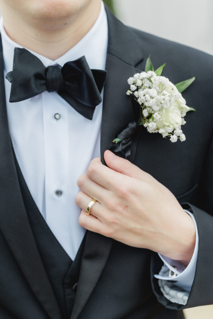 Portrait of the groom before his luxury January wedding at Ridge Pointe.