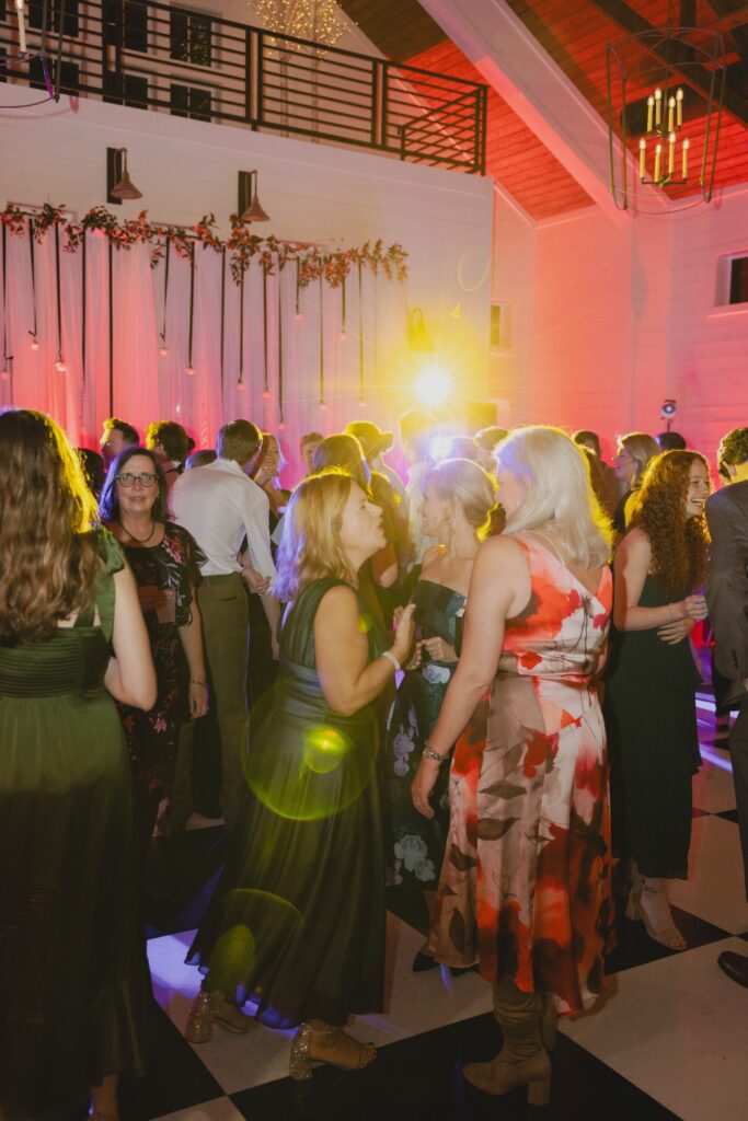 Wedding guests celebrating with the newlyweds during their Ridge Pointe reception.