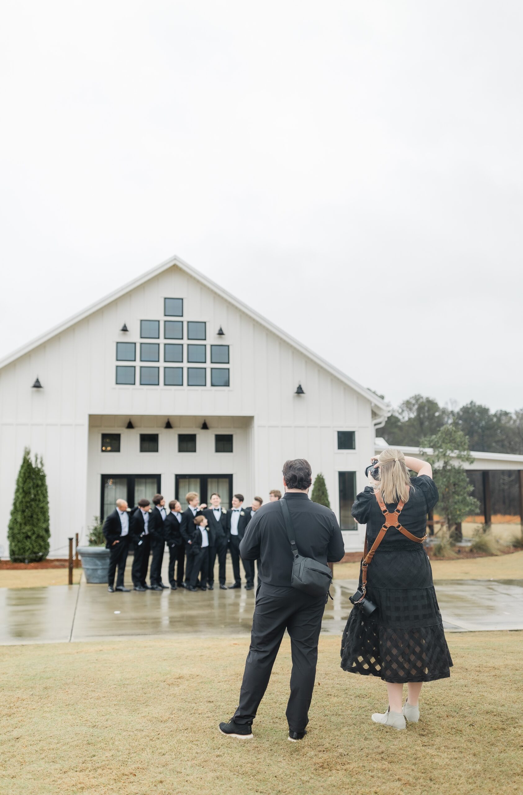 Husband and wife photography and videography team capturing a Ridge Pointe wedding.