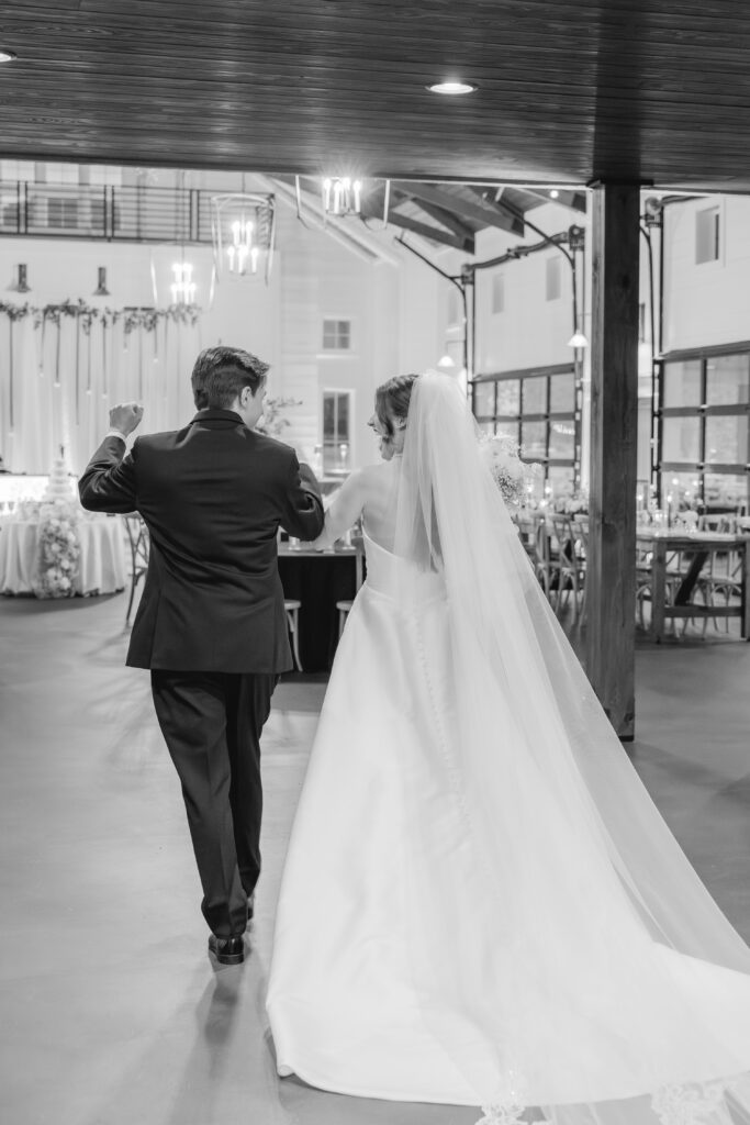 Newly married couple celebrating after their Ridge Pointe wedding ceremony.
