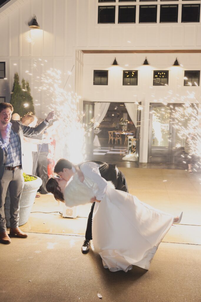Bride and groom leaving their Ridge Pointe wedding surrounded by family and friends.