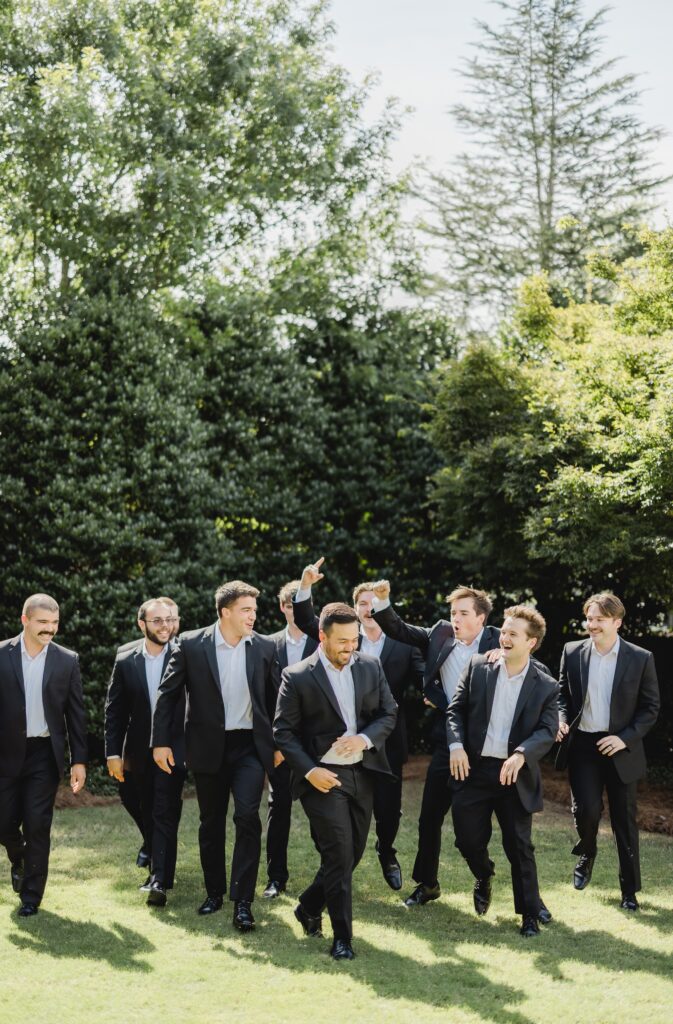 Luke posing with his groomsmen outside the chapel at Church of the Highlands Grants Mill