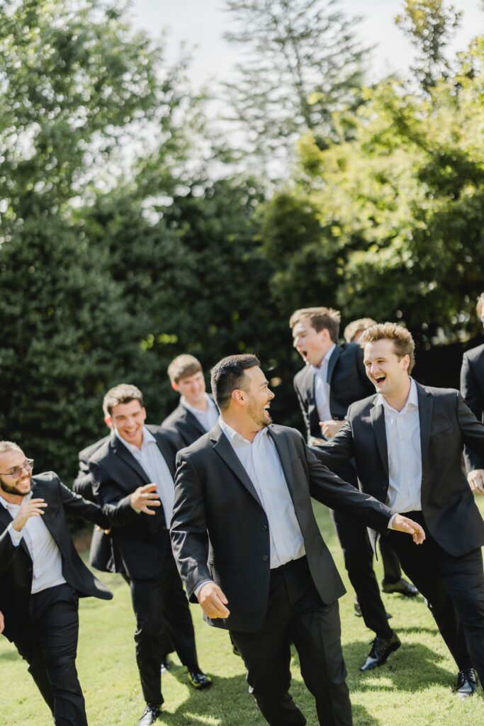 Luke posing with his groomsmen outside the chapel at Church of the Highlands Grants Mill