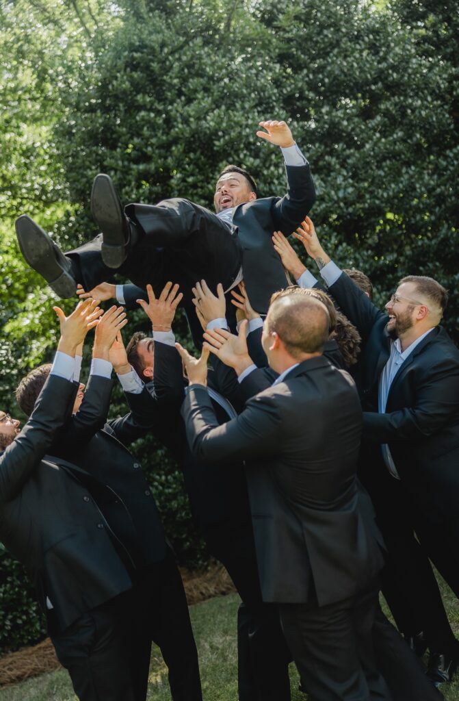 Luke getting tossed in air outside the Church of the Highlands chapel in Birmingham Alabama