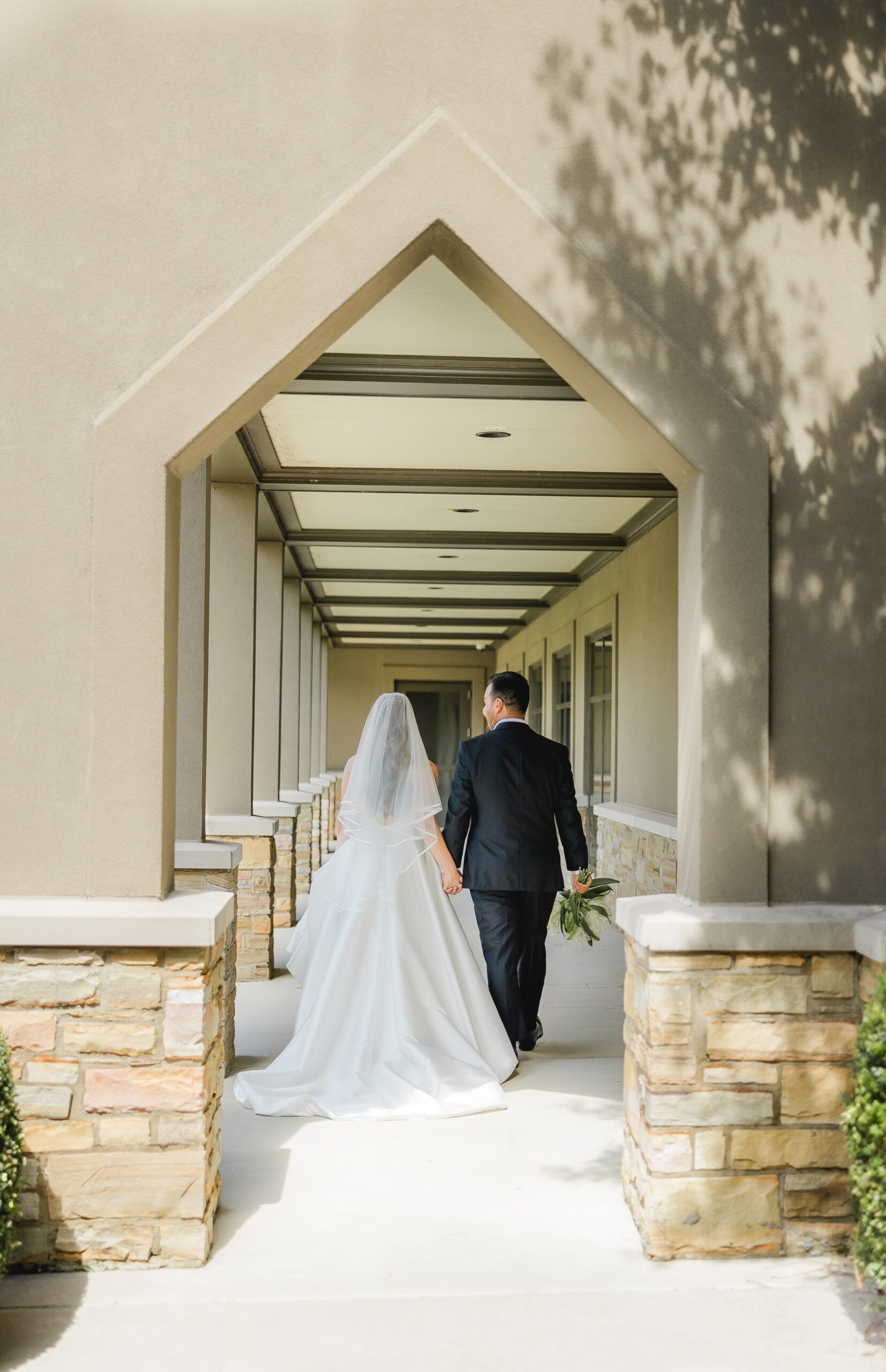 Kendall and Luke sharing a romantic portrait in the courtyard at Church of the Highlands Grants Mill