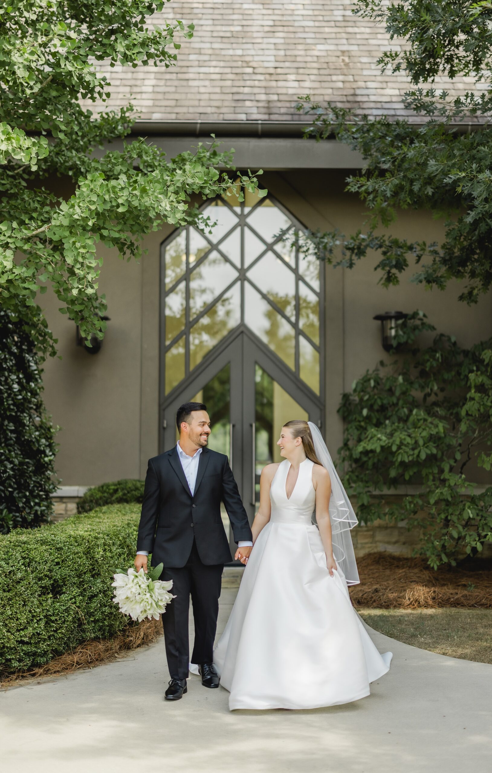 Kendall posing in her wedding dress outside the chapel at Church of the Highlands Grants Mill