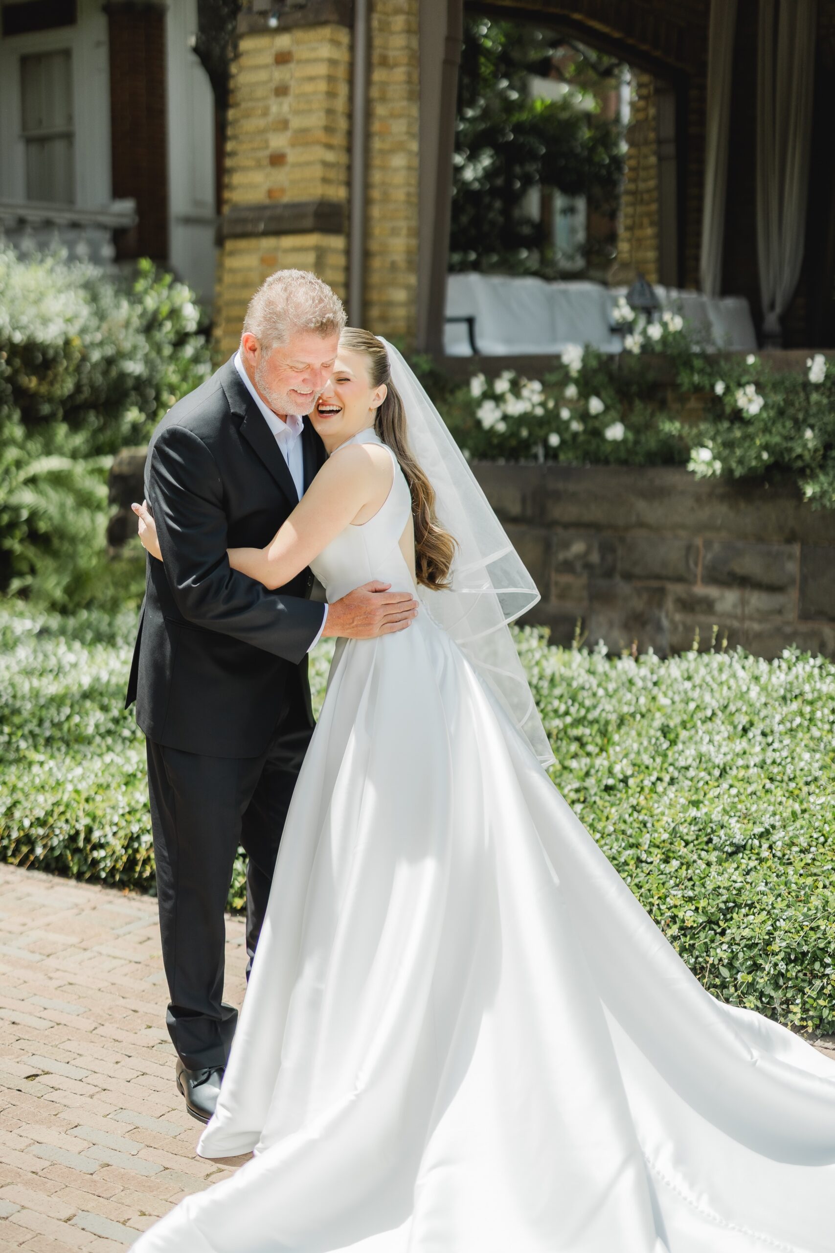 Kendall and her father sharing an emotional moment before her Birmingham wedding ceremony
