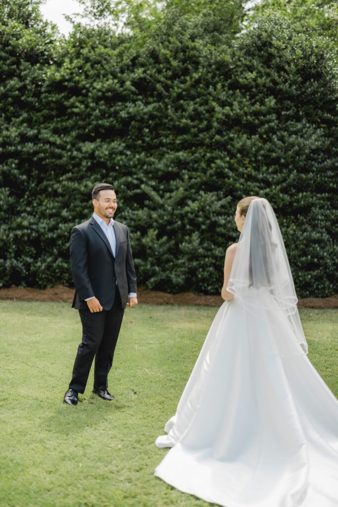 Kendall and Luke sharing an emotional first look outside the chapel at Church of the Highlands Grants Mill