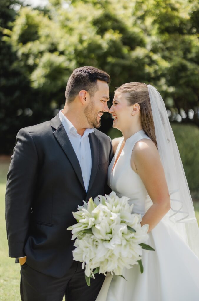 Kendall and Luke photographed together during their sunny July wedding in Birmingham Alabama