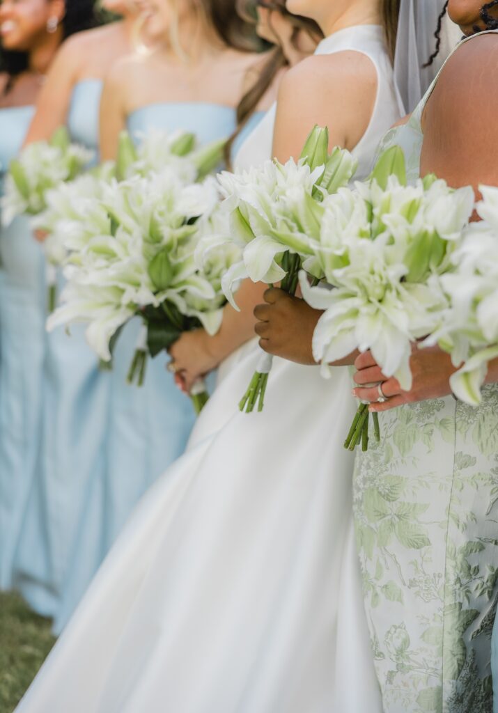 Kendall posing with her bridesmaids with florals outside the chapel during her Birmingham Alabama wedding