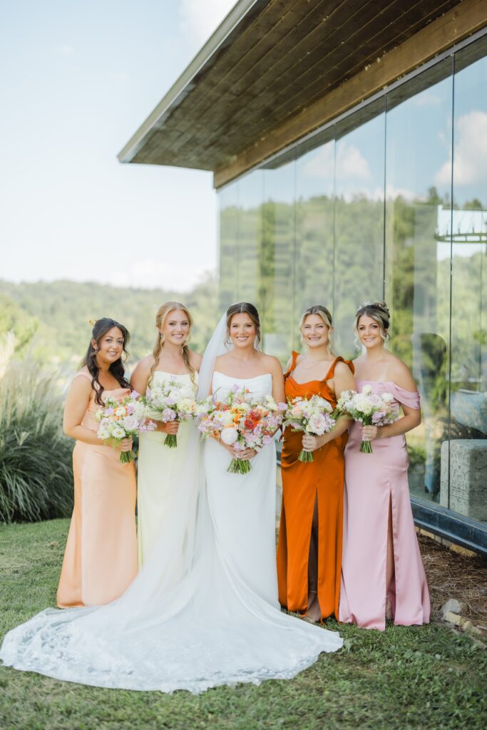 Bride and bridesmaids getting ready in the Glass House at The Barn at Smith Lake