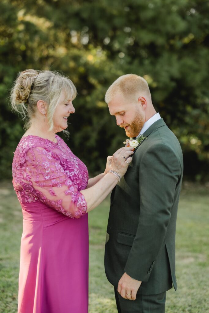 Jack getting ready with mom for his wedding at The Barn at Smith Lake