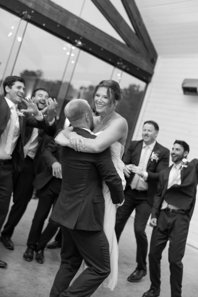 Jack and Jess celebrating with friends and family at wedding recpetion