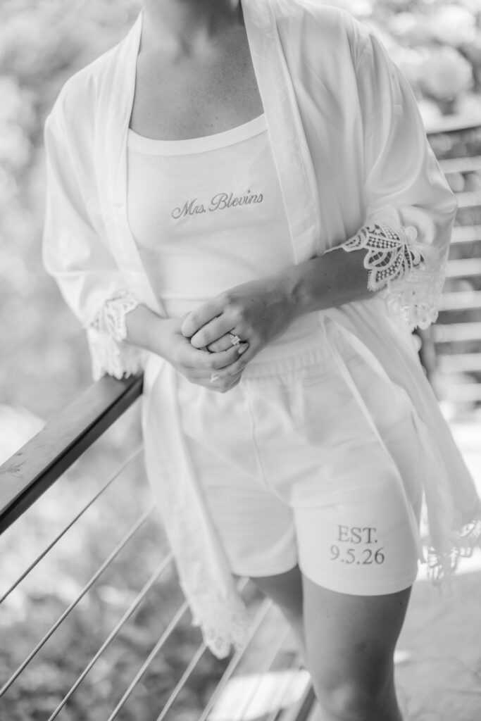 Bride Jess getting ready in the Glass House at The Barn at Smith Lake