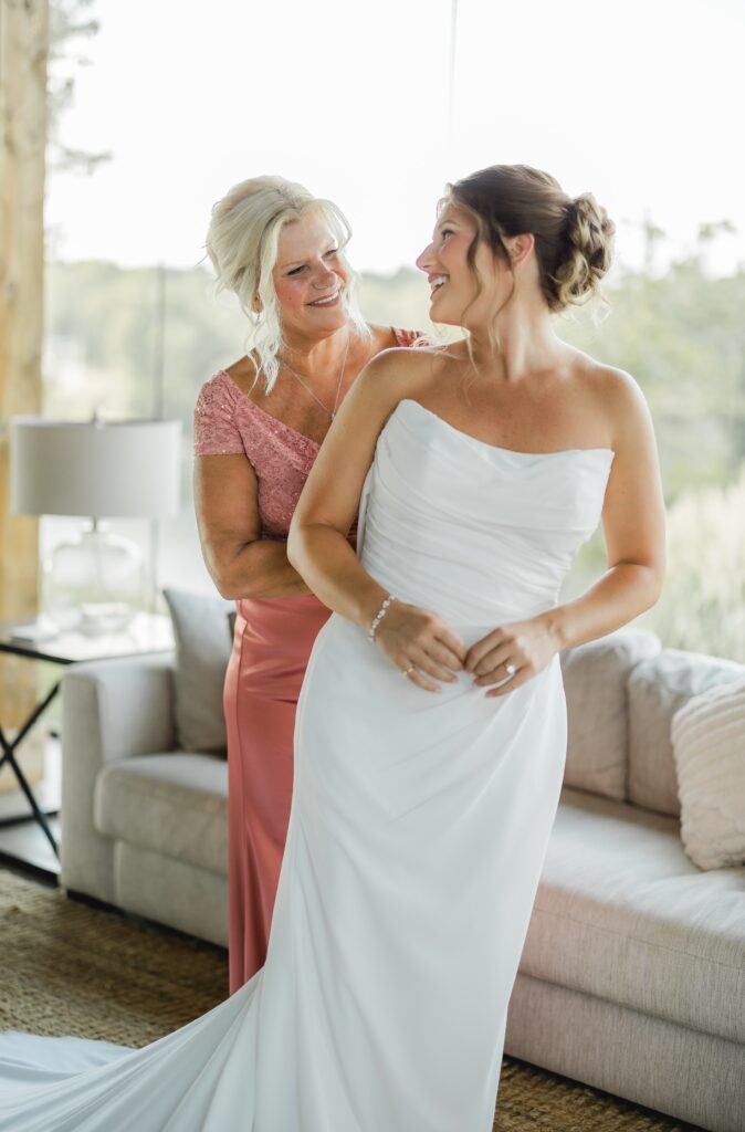 Bride getting ready with her mother before a Smith Lake wedding