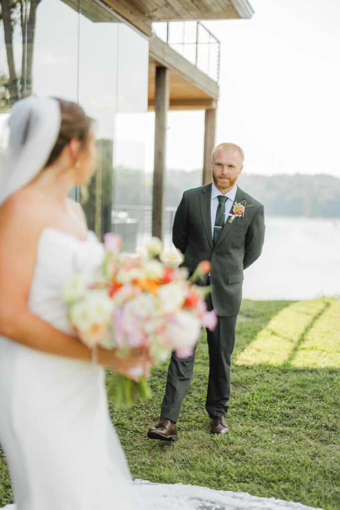 Bride turning around to see her groom during their reverse first look