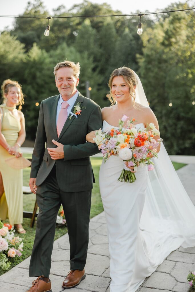 Bride walking down the aisle at The Barn at Smith Lake