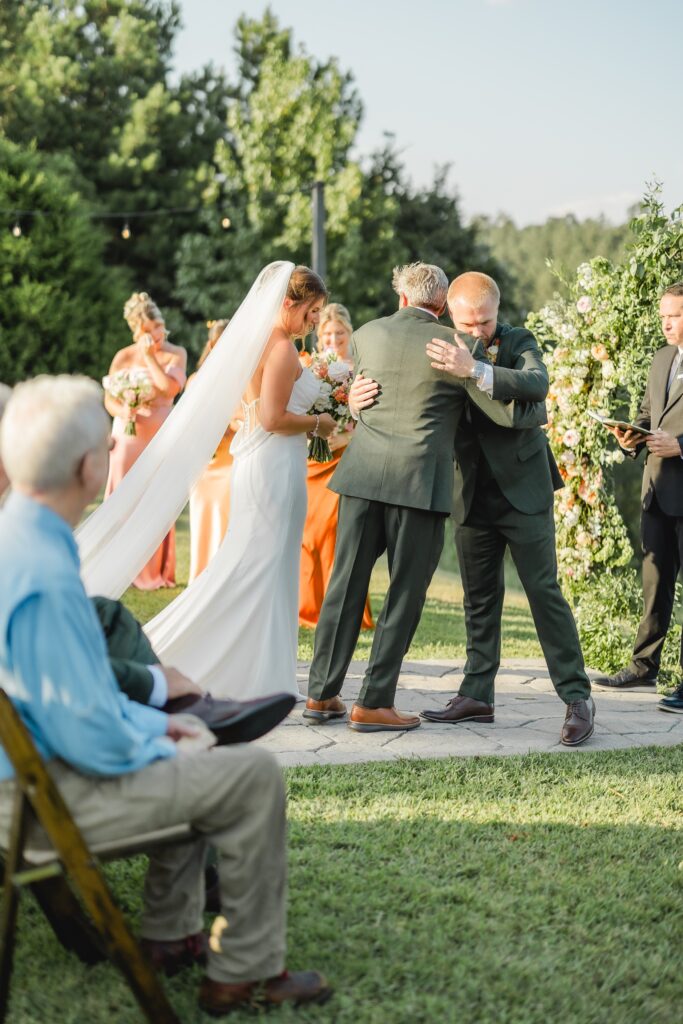 Bride walking down the aisle with dad at The Barn at Smith Lake