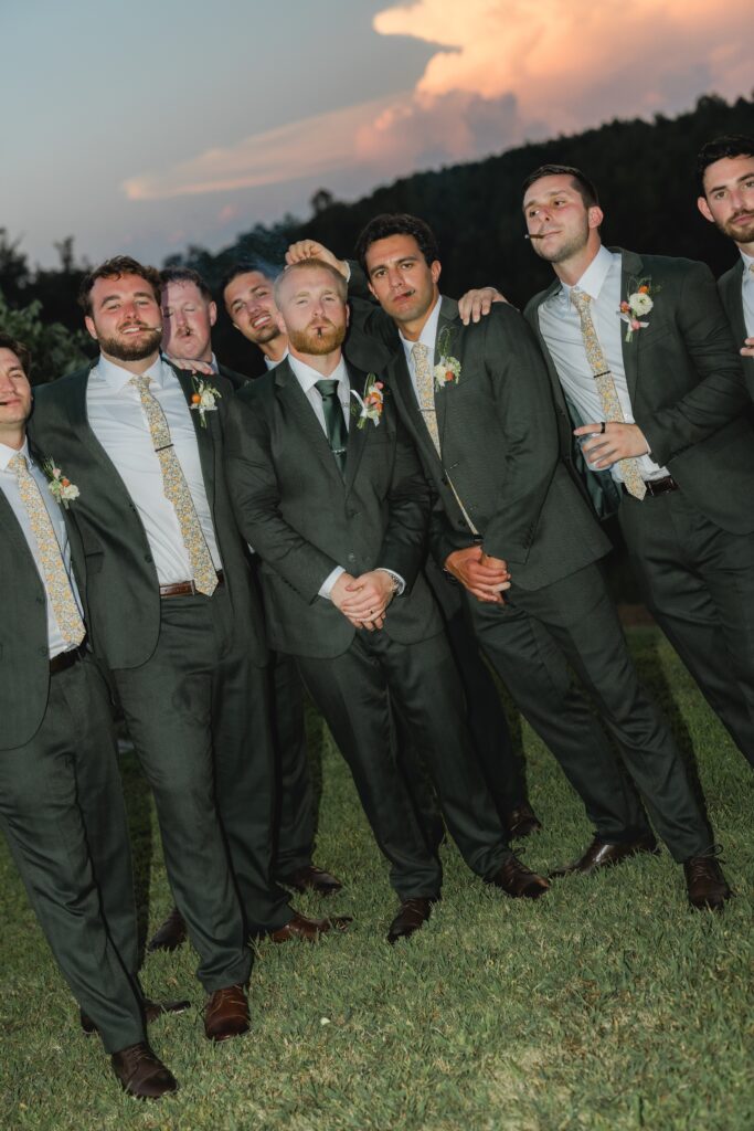 Wedding party celebrating with champagne after the ceremony at The Barn at Smith Lake