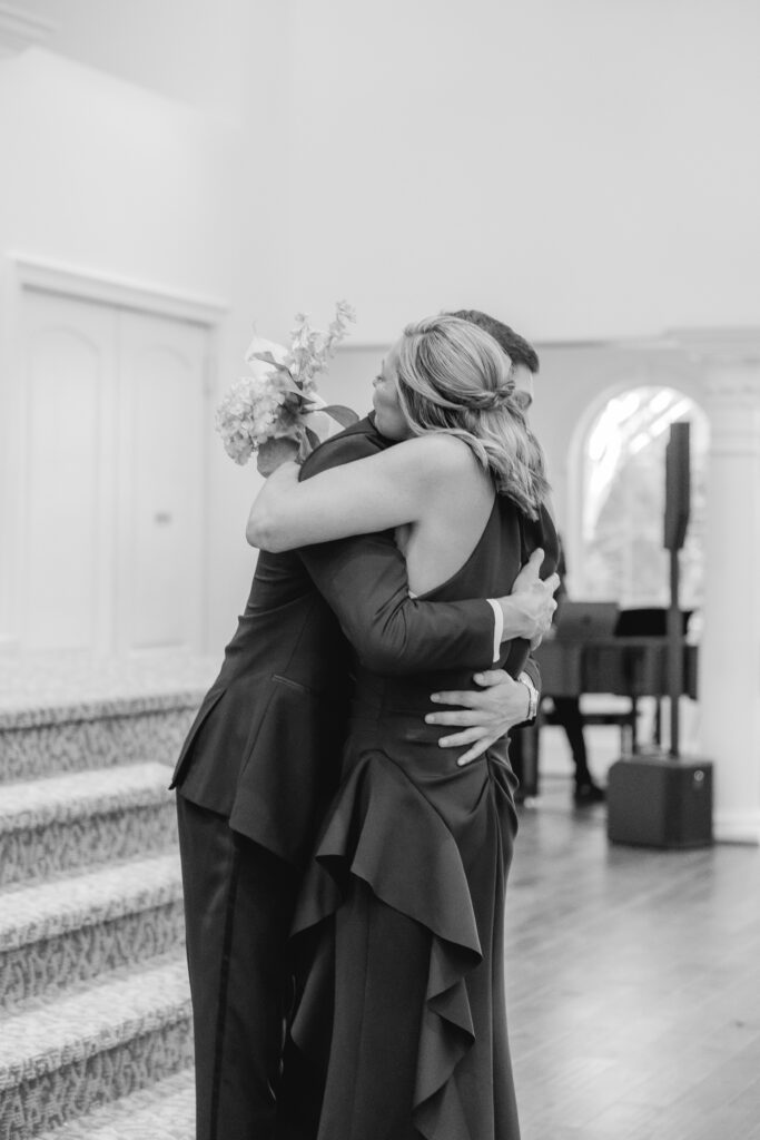 Abby’s mom embracing Jonathan before Abby walks down the aisle.