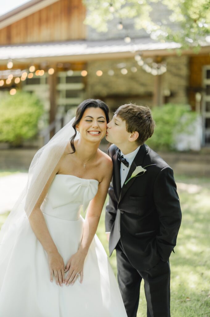 Abby and her brother sharing a sweet moment before the wedding ceremony.