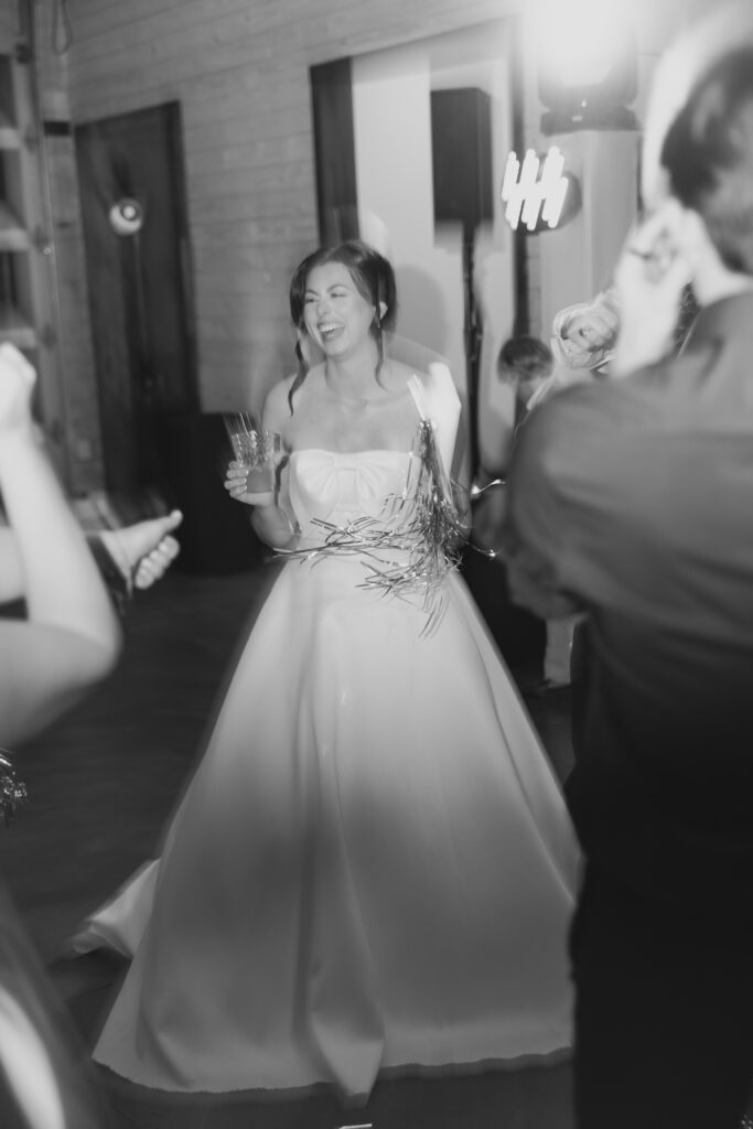 Abby celebrating with her bridesmaids during the reception.