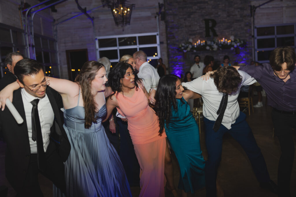 Guests dancing together at Abby and Jonathan’s wedding reception.