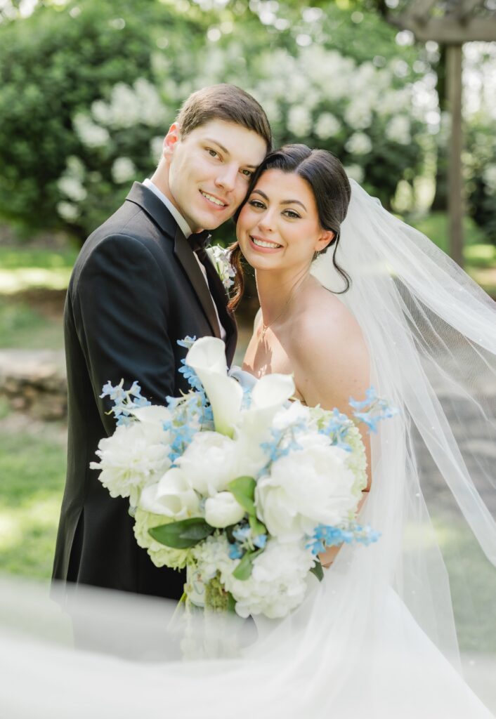 Newlyweds-to-be Abby and Jonathan smiling at Mathew’s Manor.
