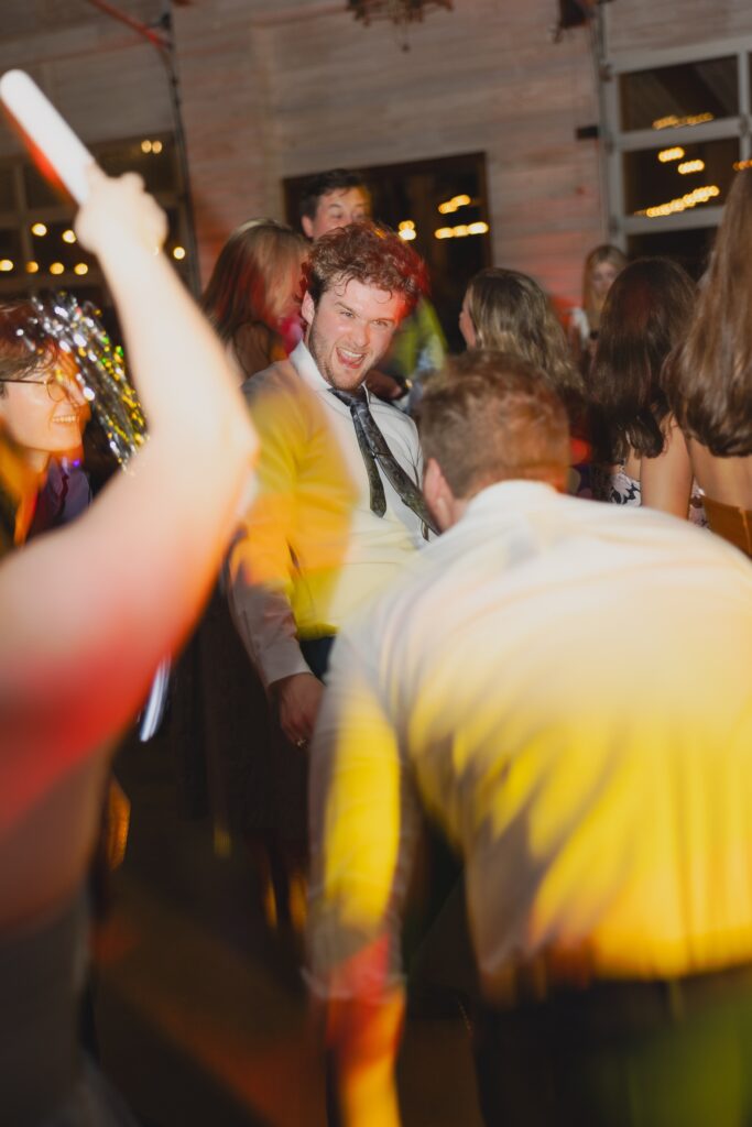Guests dancing together at Abby and Jonathan’s wedding reception.