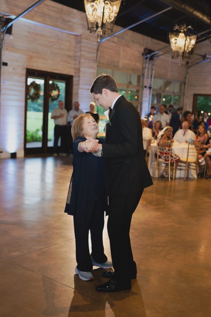 Jonathan sharing a mother-son dance with his mom during the reception.
