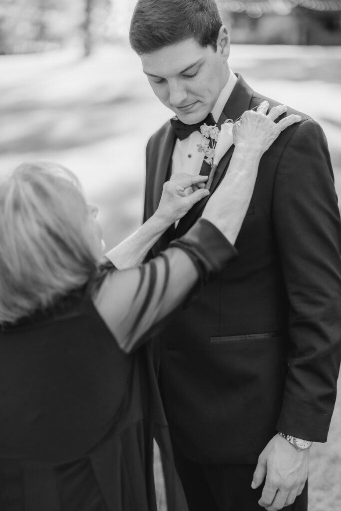 Jonathan’s mom helping him get ready for his wedding.