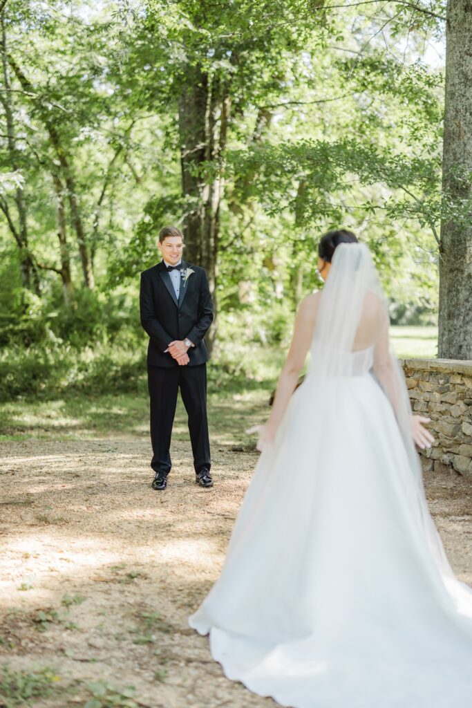 Jonathan smiling as he sees Abby in her wedding dress.