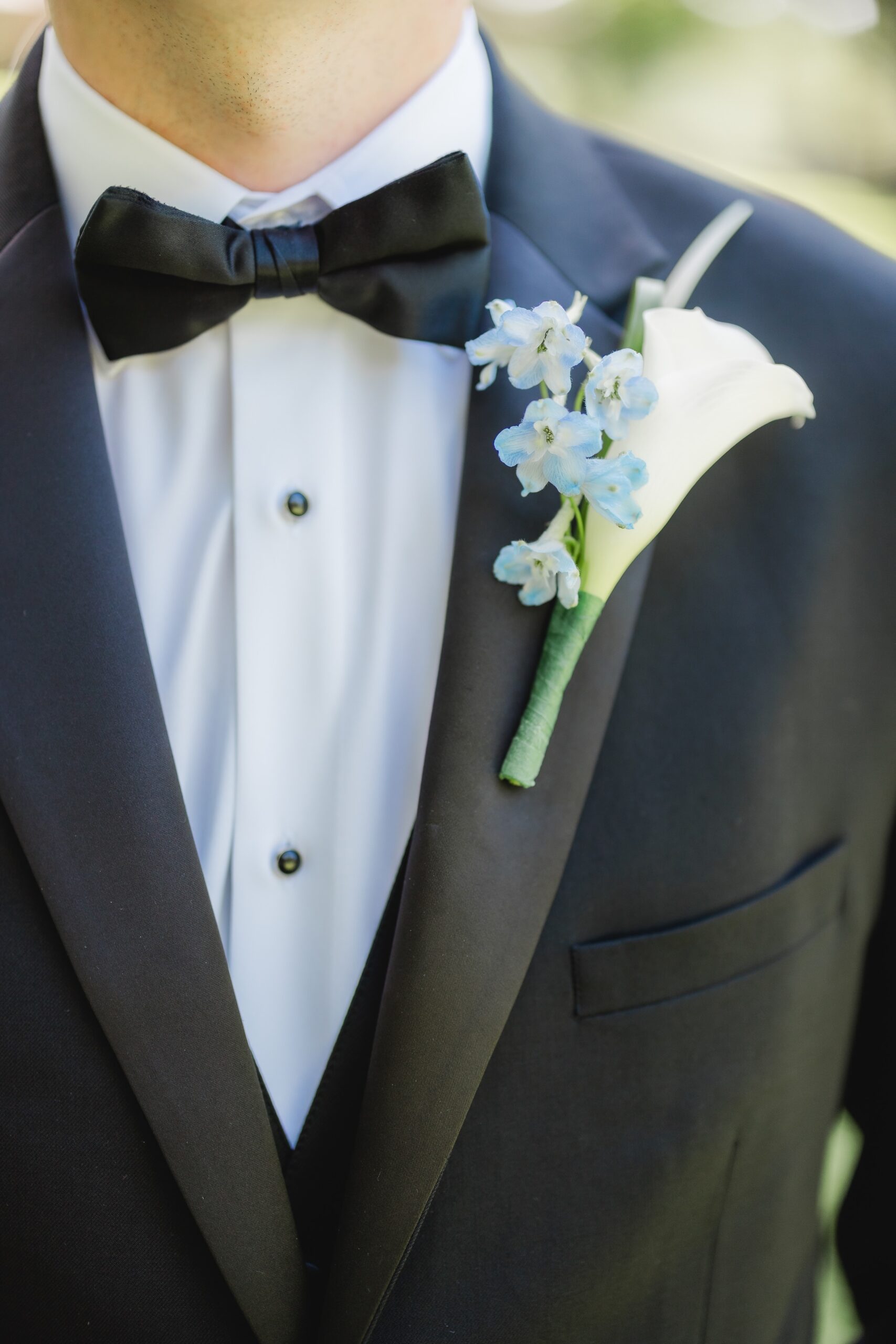Wedding-day suit details arranged for Abby and Jonathan’s celebration at Mathew’s Manor.