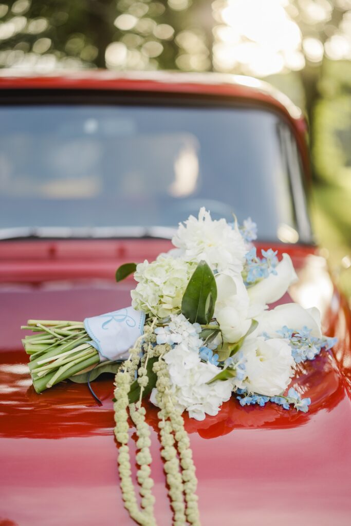 Bridal bouquet with old red pickup truck